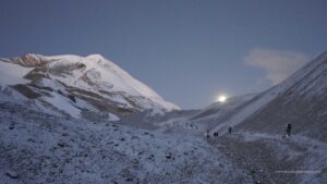 Walking with Moon light during Annapurna circuit trek near Thorong La 